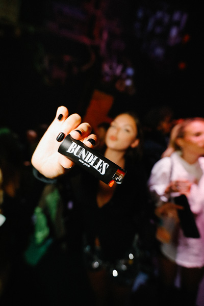 A person holding a lighter