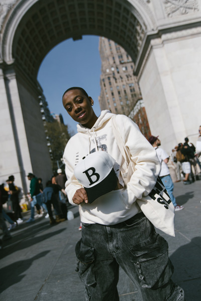 A person holding a Bundles hat
