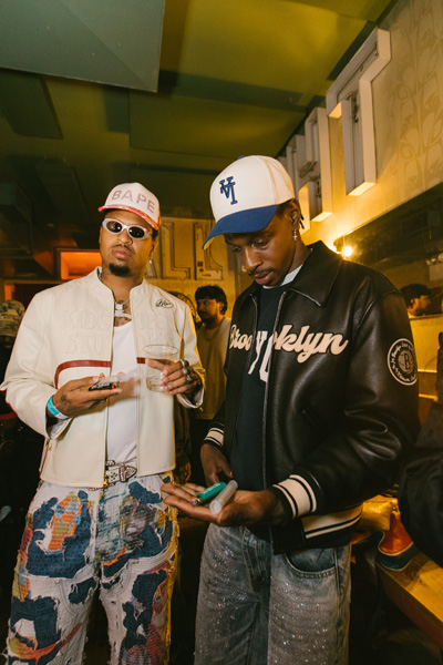 A person holding a lighter and a joint