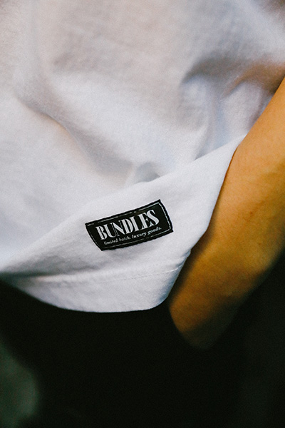 A white Bundles t-shirt