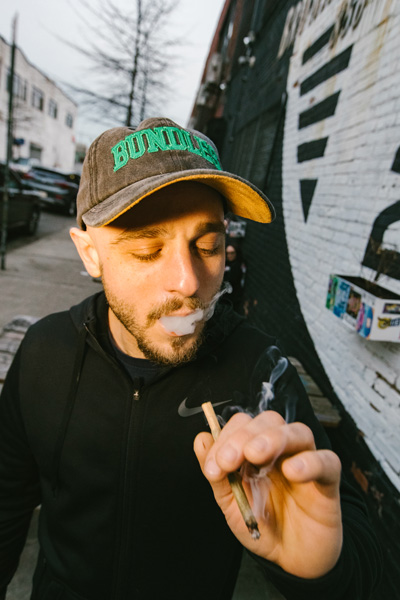 A photo of someone smoking a joint