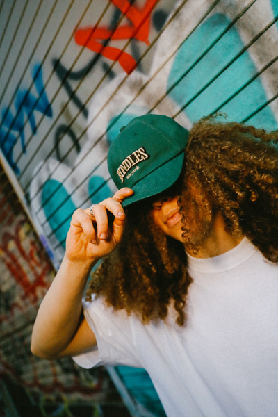 Modeling a green Bundles hat