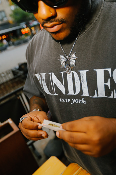 A person rolling a joint