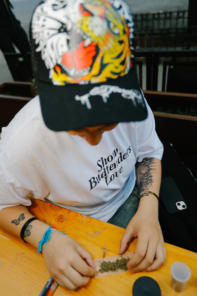 A person rolling a joint