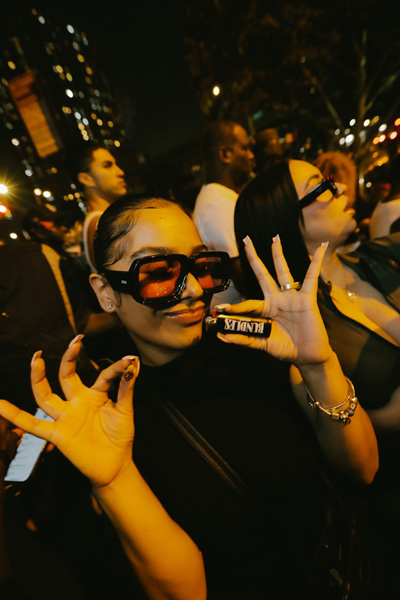 A person holding a lighter and a joint